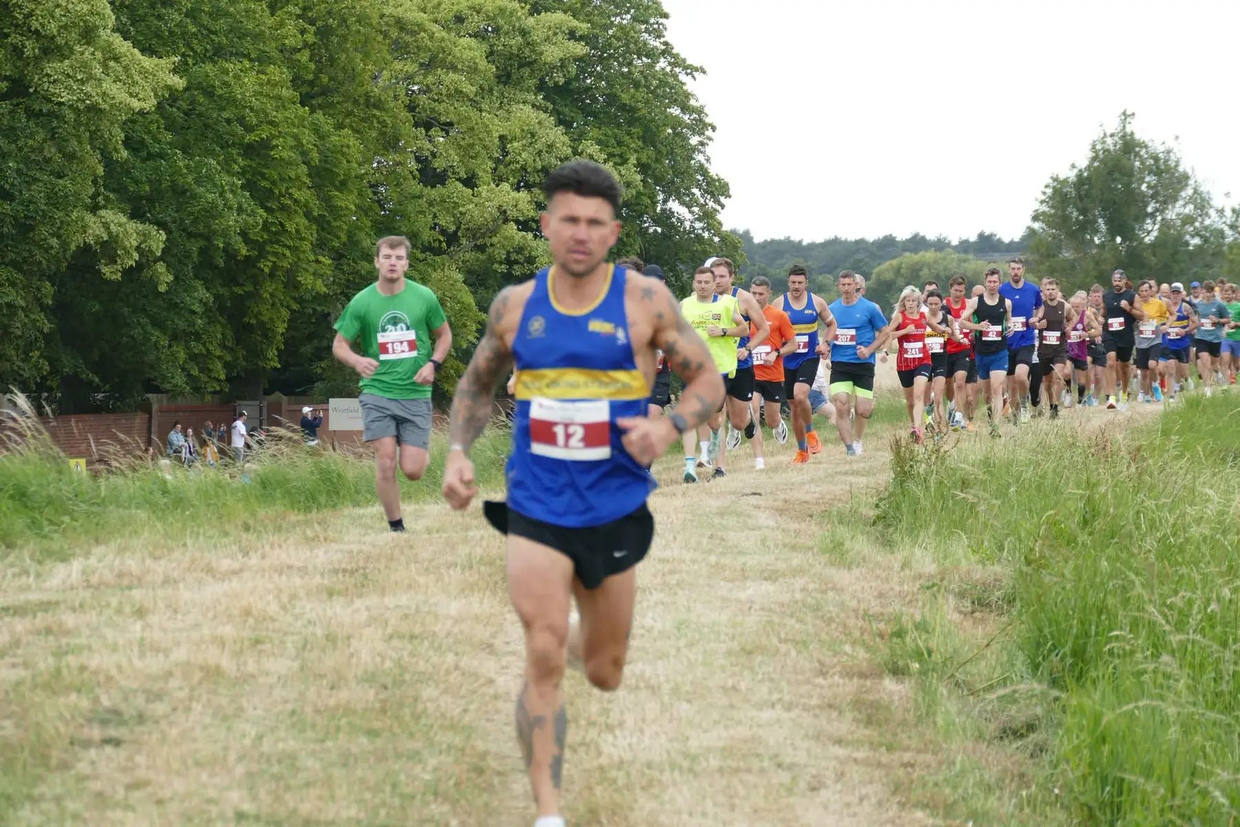 Goole Viking Striders runner leading the field along the riverbank at the Riverbank Challenge