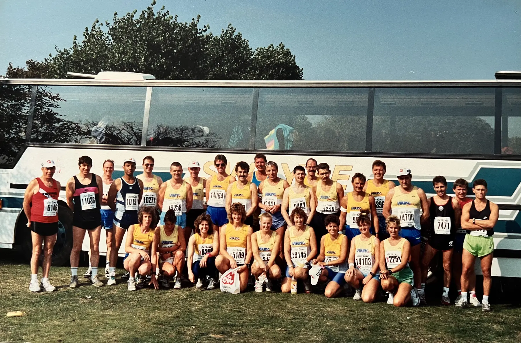 Goole Viking Striders gathered beside a coach on a club trip